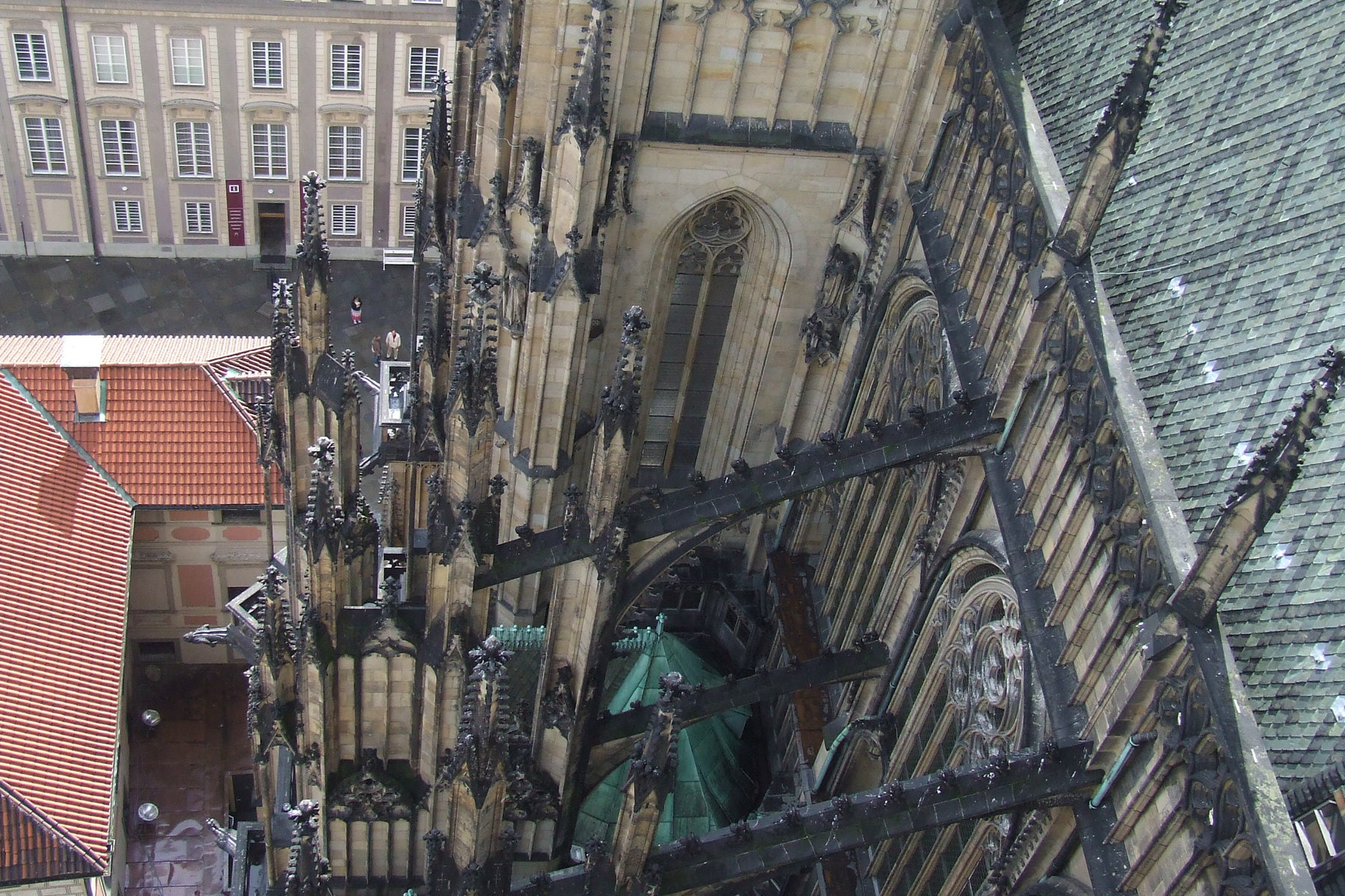 Gothic flying buttresses and spires of St. Vitus Cathedral Prague Castle — high angle view
