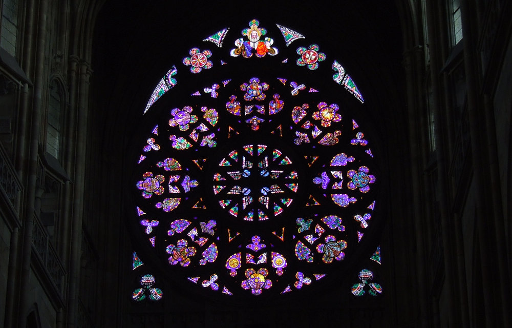 Gothic Rose Window inside St. Vitus Cathedral Prague — intricate colourful stained glass