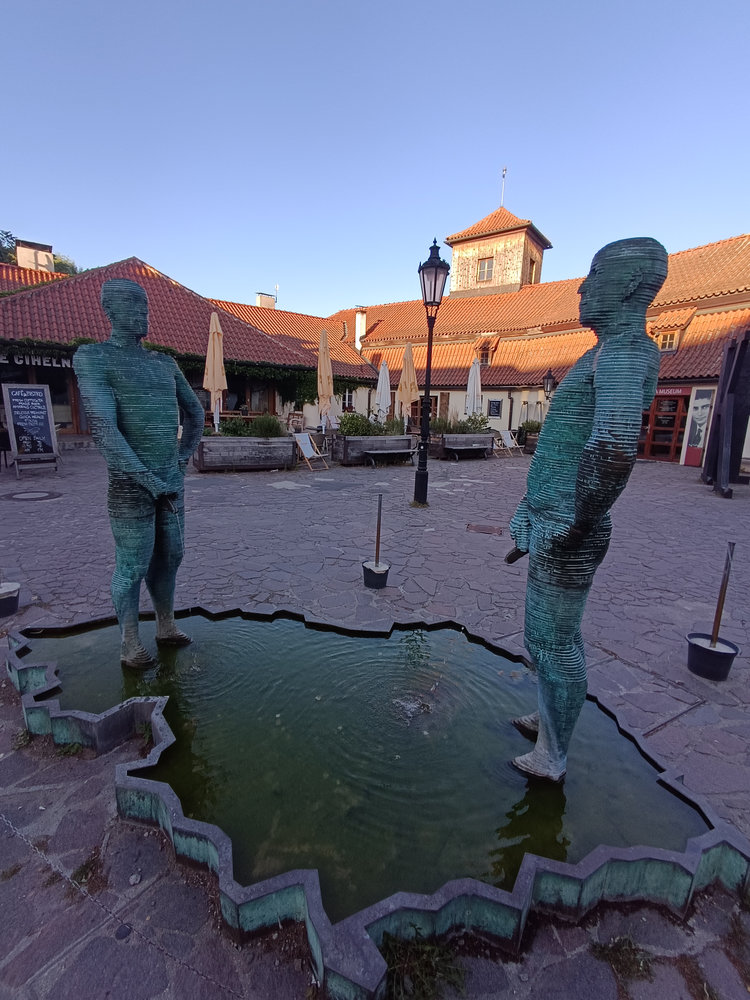 Piss sculpture fountain in the courtyard of Franz Kafka Museum Prague by David Černý