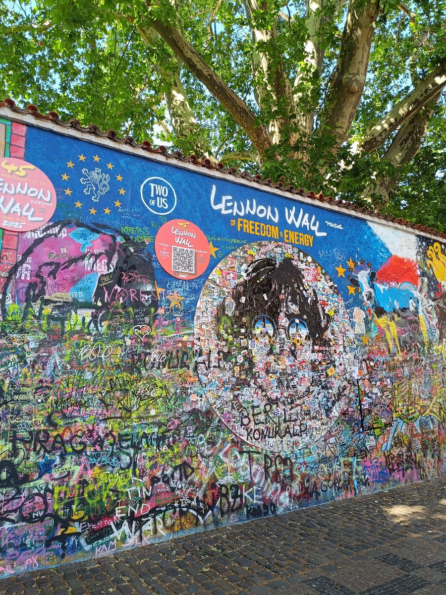 Prague Lennon Wall anniversary mural detail 2025