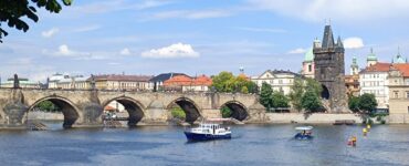 Dan Brown Prague Secret of Secrets locations 2026 — Charles Bridge at dawn