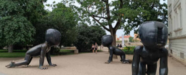 Crawling Babies sculptures by David Černý in Kampa Park, Prague, featuring giant crawling baby statues with barcode faces.