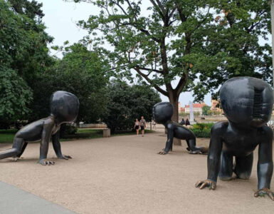 Crawling Babies sculptures by David Černý in Kampa Park, Prague, featuring giant crawling baby statues with barcode faces.